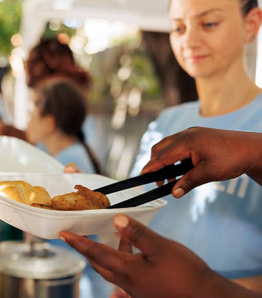 Cross Food Ministry volunteer preparing food